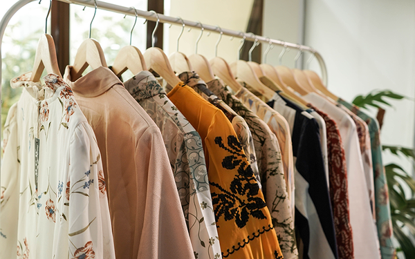 Assorted apparel on hangers.