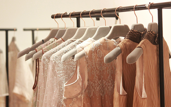 Elegant garments on hangers.